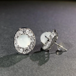 Elegant S925 silver stud earrings featuring oval chalcedony stones and cubic zirconia