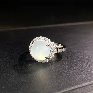 Detail of silver chalcedony ring with ice-white round cabochon and pavé settings