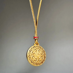 Exquisite gold filigree flower pendant necklace with elegant woven chain and red accents