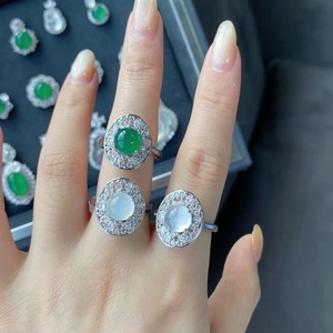 Close-up of green and ice white chalcedony rings with halo diamond setting