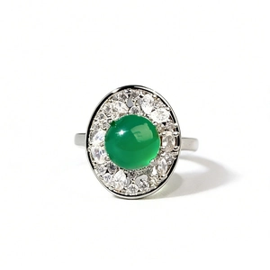 Elegant emerald green chalcedony oval ring with halo diamond setting on silver band