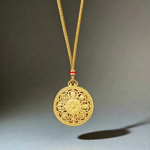 Ancient gold Fu pendant necklace with hollowed craftsmanship and red bead accent