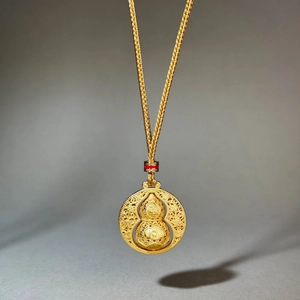 Antique gold rotating gourd pendant necklace with traditional hollow filigree craft