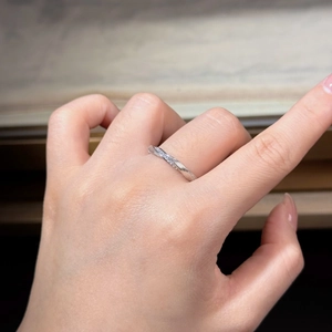 Detail of S925 sterling silver Mobius ring with sparkling pavé cubic zirconia