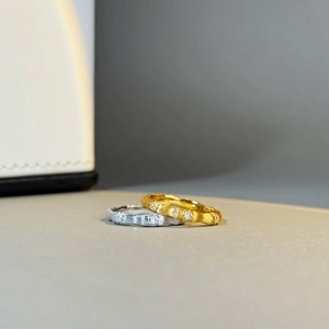 Detailed shot of brushed S925 sterling silver bamboo rings with tiny inlaid diamonds