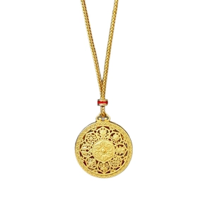 Traditional filigree Fu pendant necklace in gold finish with a woven chain on white background