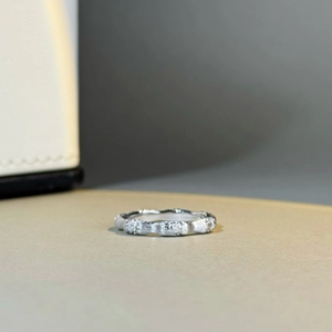 Macro detail of S925 sterling silver ring featuring a unique brushed bamboo knot texture