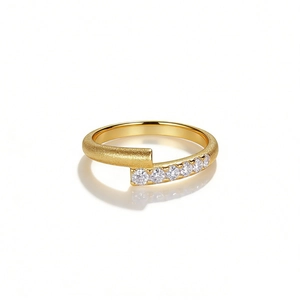 Modern 925 silver bypass ring with matte 18K gold finish and sparkling crystal stones