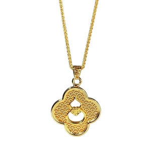 Golden clover pendant necklace with a filigree gourd design on a twisted rope chain