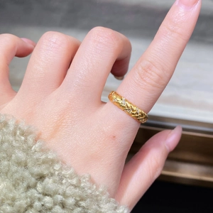 Wheat pattern braided ring in 18K gold finish with white zircons on hand