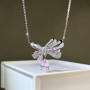 Bowknot silver necklace with pink pear-cut stone and sparkling zircon pavé setting
