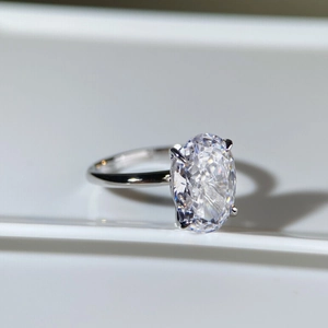 Macro view of oval cut ice flower cubic zirconia ring in a polished four-prong setting