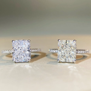 Close-up of radiant cut 925 silver rings with pavé setting and classic 4-prong zircon