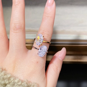 Macro shot of S925 sterling silver ring with oval ice-cut crystal in 18K gold and silver