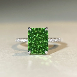 Elegant 925 silver emerald cut green stone ring with side micro-pave white stones