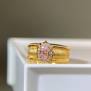 18K gold-plated ring with frosted band, pink oval center stone and white accent gems