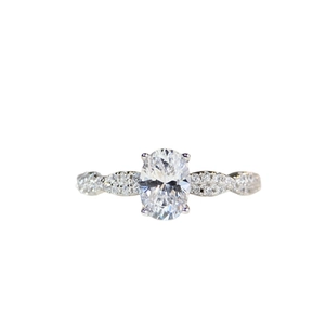 Elegant 1 carat oval moissanite ring with twisted pave diamond band in 925 sterling silver