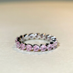 925 sterling silver eternity ring with pink heart-shaped stones and polished silver finish