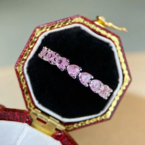 Elegant 925 sterling silver heart ring featuring pink heart-shaped crystals