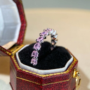 925 silver ring featuring pink heart-shaped stones in a red vintage jewelry box