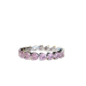 925 silver eternity ring with heart-shaped pink crystals in a row on white background