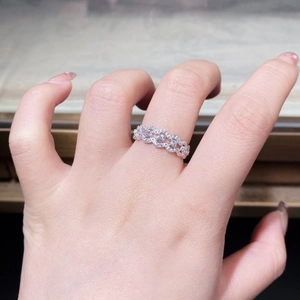 Close-up of S925 silver lace ring with sparkling zircons on a finger