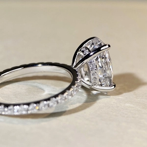S925 silver ring with 5-carat oval ice cut zircon and diamond paved four-claw band
