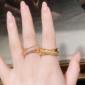 Detail view of criss-cross ring with beaded edges and pavé set cubic zirconia