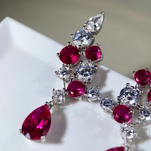 Luxurious S925 sterling silver drop earrings with pear-shaped red corundum and white gems
