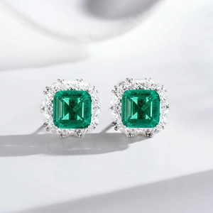 S925 sterling silver emerald halo stud earrings featuring vibrant green step-cut stones