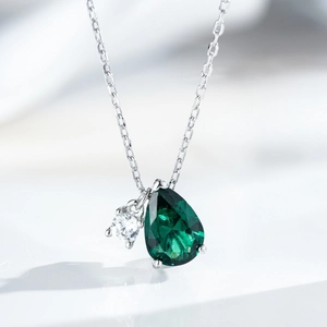 Elegant S925 silver necklace with pear-shaped emerald pendant and round cubic zirconia