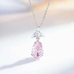 S925 silver necklace with a large pear-shaped pink gemstone pendant and leaf accents