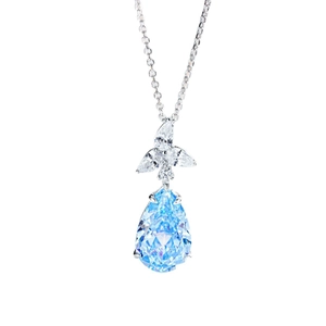 Elegant S925 silver necklace with pear-shaped light blue gemstone and floral diamond accents