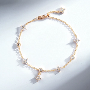 Detailed close-up of S925 hallmark on gold plated star and zircon bracelet clasp