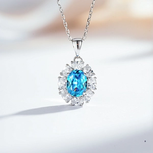 Detailed macro of S925 sterling silver necklace with oval blue gemstone and zircon halo