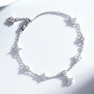 Detailed macro view of S925 sterling silver star bracelet with sparkling zircon charms