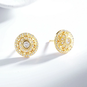 Macro shot of 24K gold plated sunflower stud earrings with sparkling center zircon crystal