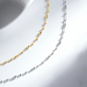 Macro detail of S925 silver beaded necklaces in gold and silver plating finish