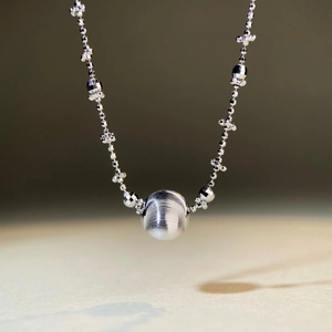 925 silver necklace featuring a brushed metal ball pendant with multi-faceted beads
