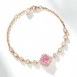 Detailed close-up of a rose gold bracelet featuring a square pink gemstone and pavé diamonds