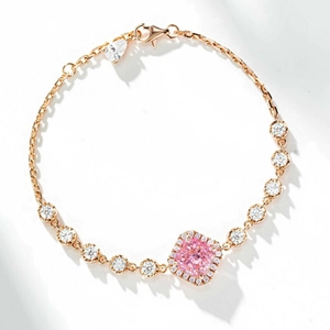 Elegant rose gold bracelet with cushion-cut pink gemstone and halo diamond setting