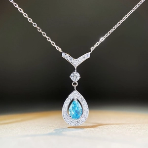 Elegant S925 silver necklace with pear-shaped blue stone and V-shaped diamond accents