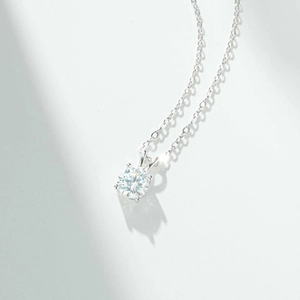 Classic 1 carat moissanite solitaire necklace with a 4-prong silver setting and fine chain