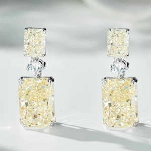 Macro shot of S925 silver earrings with rectangle ice cut yellow carbon diamonds