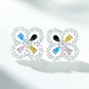 Elegant silver four-leaf clover stud earrings with colorful zircons on white background