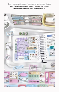 Close-up of decorative washi tape with hand-drawn animal patterns and English quotes