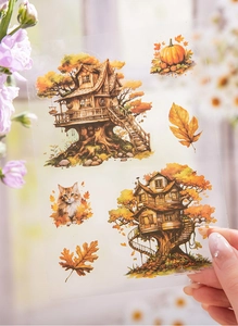 Detail of PET stickers featuring autumn tree house and cat illustrations for scrapbooking