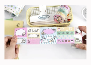 Detailed macro view of cute cat themed washi tape with pastel colors and DIY illustrations