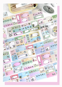 Close-up of cute cartoon washi tape set featuring writeable pandas and rabbits