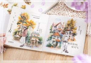 Close-up of watercolor building stickers and floral patterns in a PET scrapbooking journal